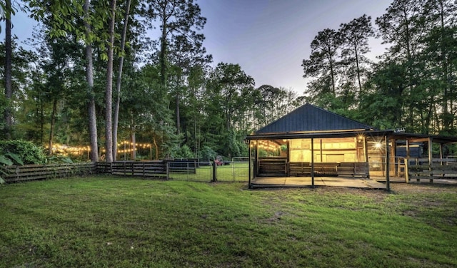 yard at dusk with an outdoor structure