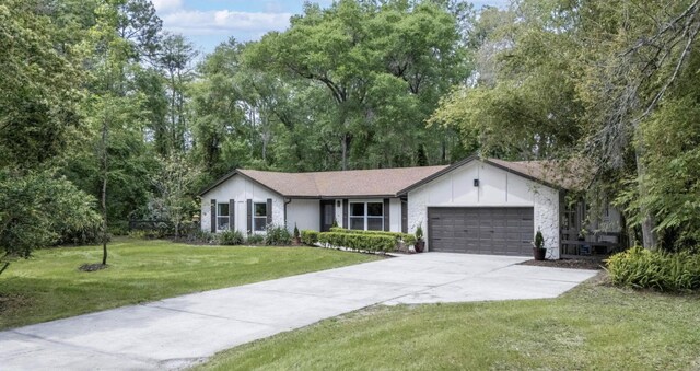 ranch-style home with a front yard and a garage