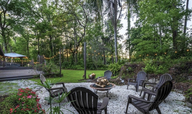 view of patio / terrace with a fire pit