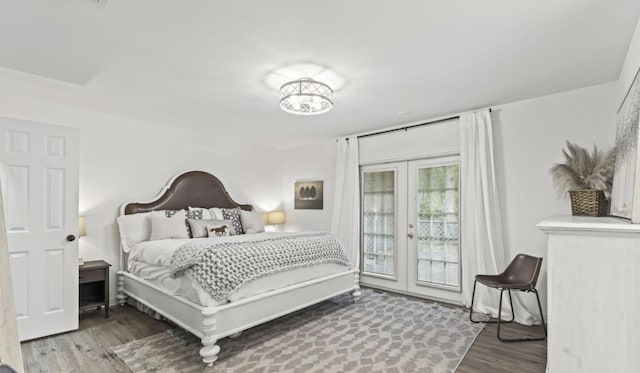 bedroom with hardwood / wood-style flooring, access to outside, and french doors