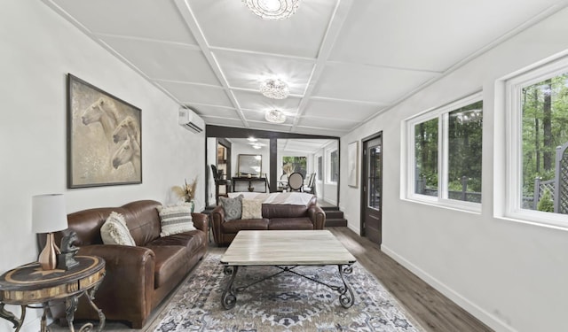 living room featuring coffered ceiling, an AC wall unit, and dark hardwood / wood-style flooring