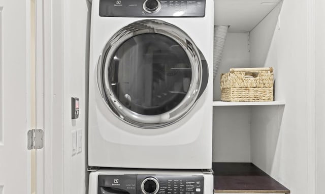 laundry room with stacked washer and clothes dryer