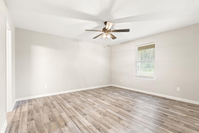 spare room with ceiling fan and light hardwood / wood-style flooring