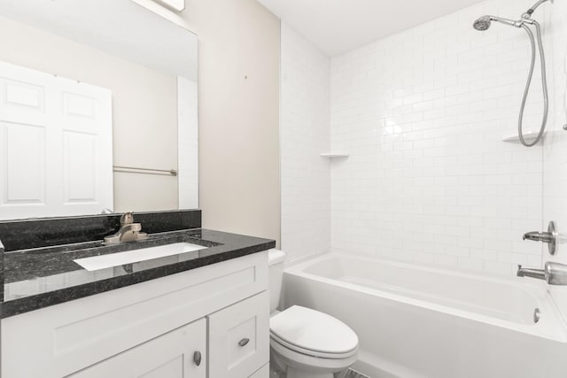 full bathroom with vanity, toilet, and tiled shower / bath combo