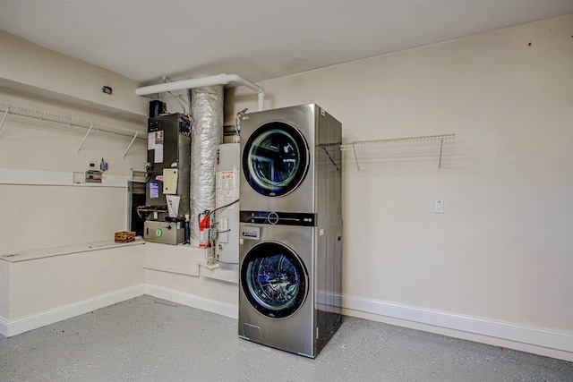 clothes washing area with stacked washer / drying machine