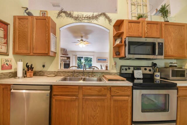 1711 Old Beach Rd, Saint Augustine, FL 32080 - kitchen featuring stainless steel appliances, ceiling fan, light countertops, and open shelves