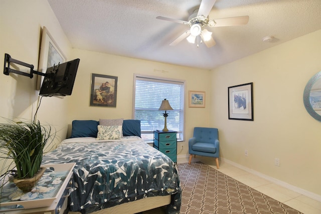 1711 Old Beach Rd, Saint Augustine, FL 32080 - tiled bedroom featuring a textured ceiling and ceiling fan