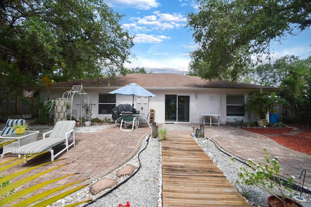 1711 Old Beach Rd, Saint Augustine, FL 32080 - back of house featuring stucco siding and a patio area