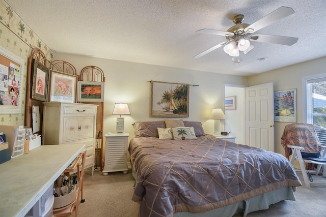 1711 Old Beach Rd, Saint Augustine, FL 32080 - bedroom with light colored carpet, a textured ceiling, a ceiling fan, and wallpapered walls