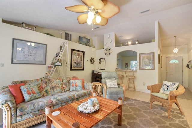 1711 Old Beach Rd, Saint Augustine, FL 32080 - tiled living room featuring lofted ceiling, ceiling fan, and arched walkways