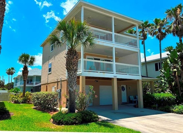 view of building exterior featuring driveway and an attached garage