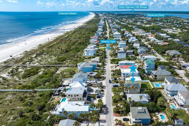 bird's eye view featuring a water view and a view of the beach