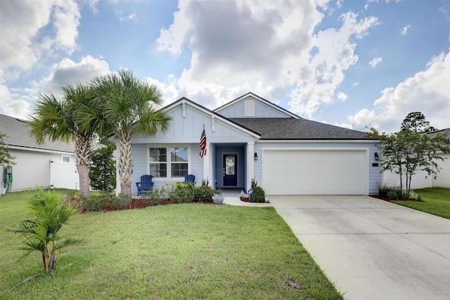 view of front of house featuring a front yard and a garage