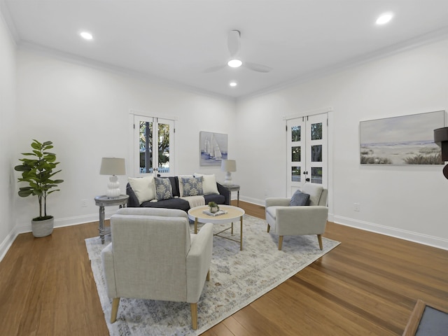 living room with a ceiling fan, recessed lighting, baseboards, and wood finished floors
