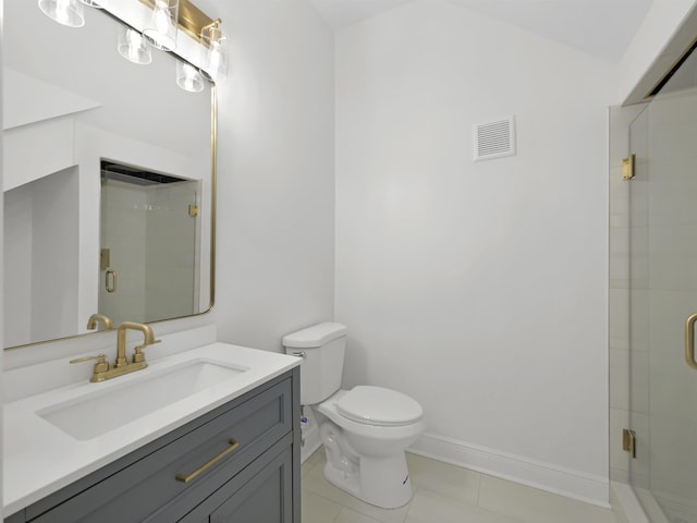 bathroom featuring baseboards, a shower stall, toilet, and vanity
