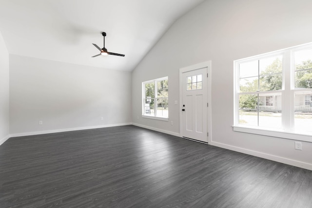 entryway featuring a ceiling fan, high vaulted ceiling, dark wood-type flooring, and baseboards