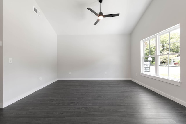 empty room featuring vaulted ceiling, ceiling fan, dark wood-type flooring, and baseboards