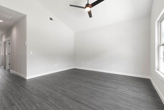 unfurnished room featuring a ceiling fan, lofted ceiling, dark wood-type flooring, and baseboards