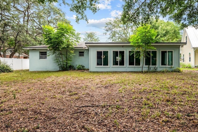 603 Mariposa St, Saint Augustine Beach, FL 32080 - back of house with stucco siding