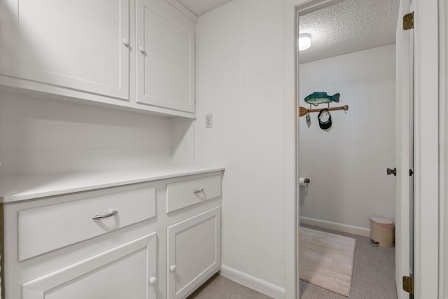 bathroom with a textured ceiling