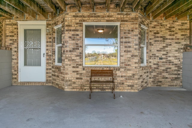 doorway to property with a patio