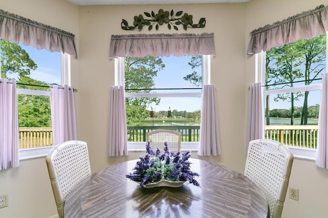 dining room featuring a water view