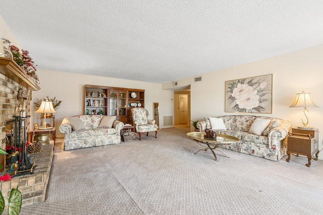 living room with carpet flooring, a textured ceiling, and a brick fireplace