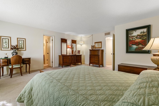 carpeted bedroom featuring a textured ceiling