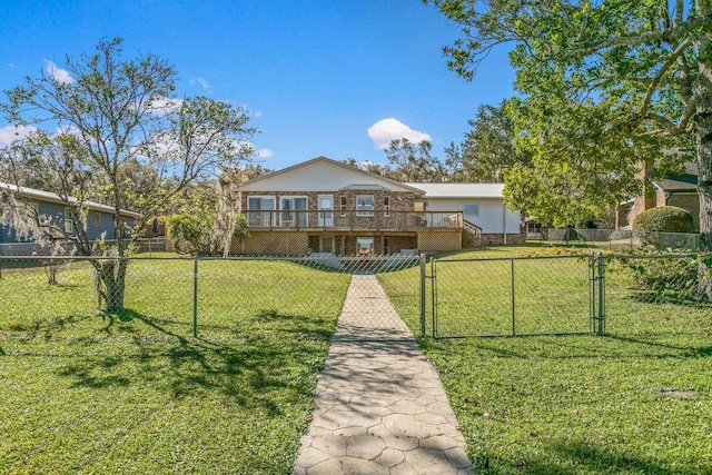 view of front of home with a wooden deck and a front lawn