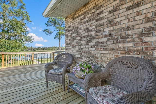 wooden terrace with a water view