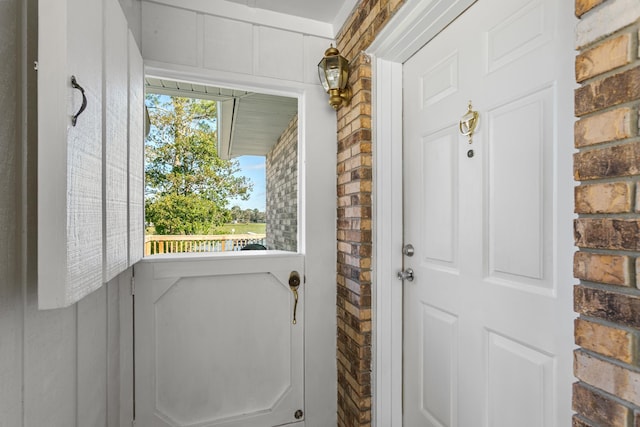 doorway with brick wall