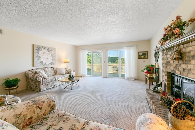 carpeted living room featuring a textured ceiling and a brick fireplace