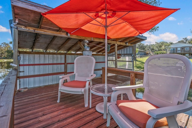 wooden deck featuring a water view