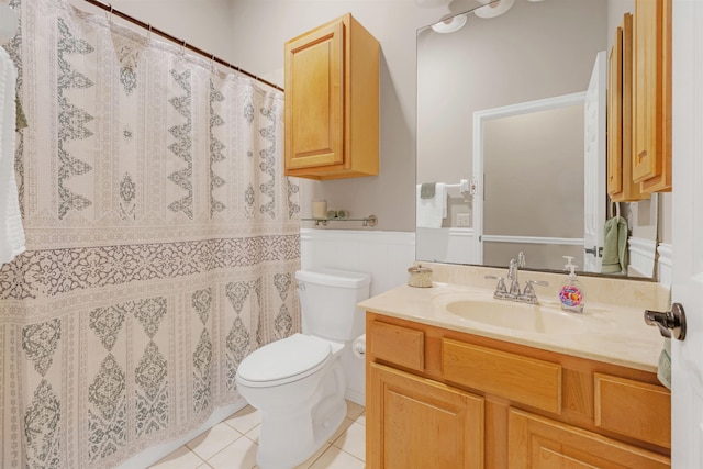 bathroom featuring tile patterned flooring, vanity, and toilet