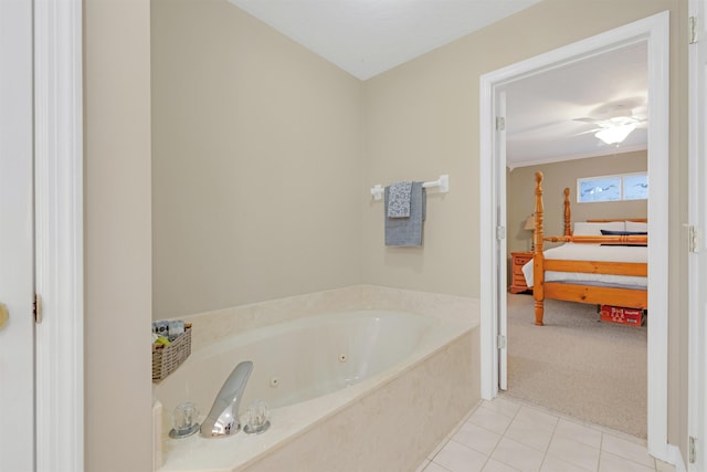 bathroom with tile patterned floors and a bath