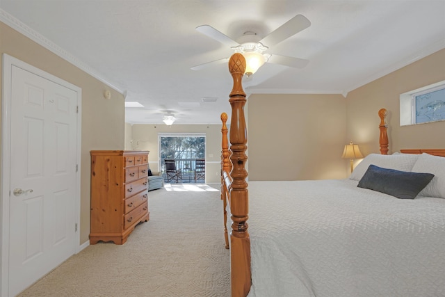 carpeted bedroom with ceiling fan and ornamental molding