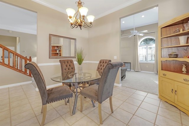 tiled dining space featuring ceiling fan with notable chandelier and crown molding