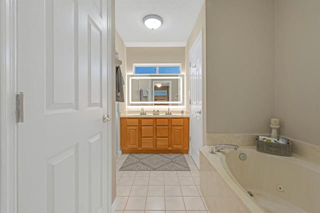 bathroom featuring vanity, tiled bath, and tile patterned floors