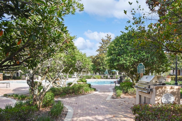 10075 Gate Pkwy Unit 907, Jacksonville, FL 32246 - surrounding community featuring area for grilling, a swimming pool, and a patio