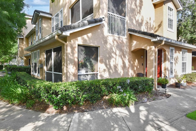 10075 Gate Pkwy Unit 907, Jacksonville, FL 32246 - view of home's exterior with stucco siding and a balcony