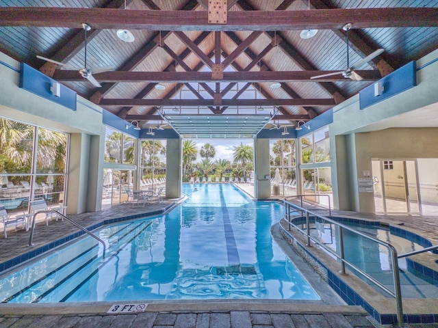 view of pool with ceiling fan and a patio