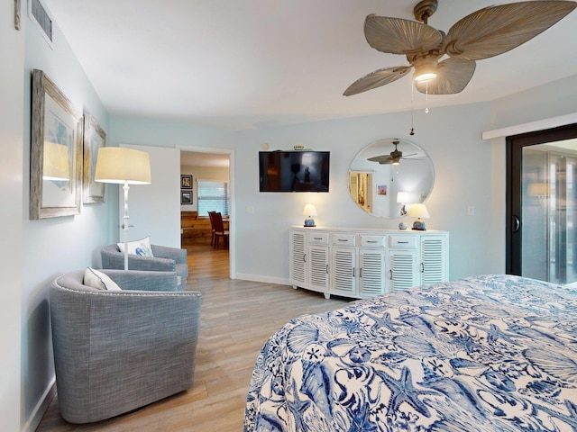 bedroom with light wood-type flooring and ceiling fan