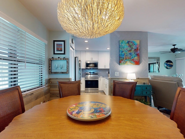 dining room featuring ceiling fan