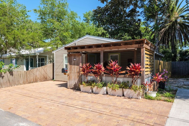 view of front of house featuring fence
