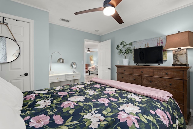bedroom with crown molding, visible vents, and ceiling fan