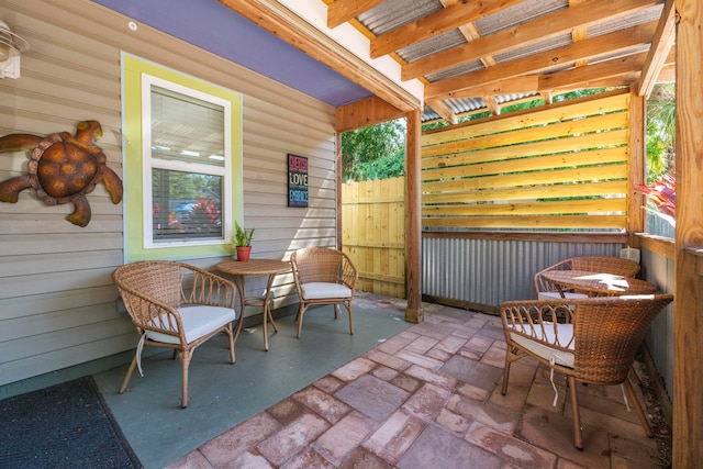 view of patio featuring fence