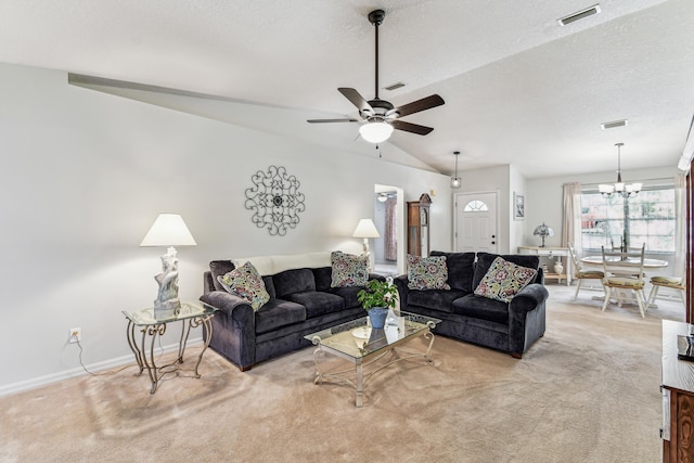 living room featuring visible vents, vaulted ceiling, light carpet, and a textured ceiling