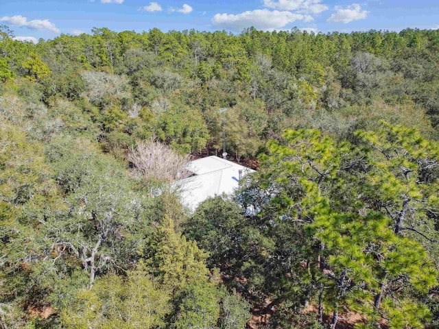 aerial view featuring a forest view