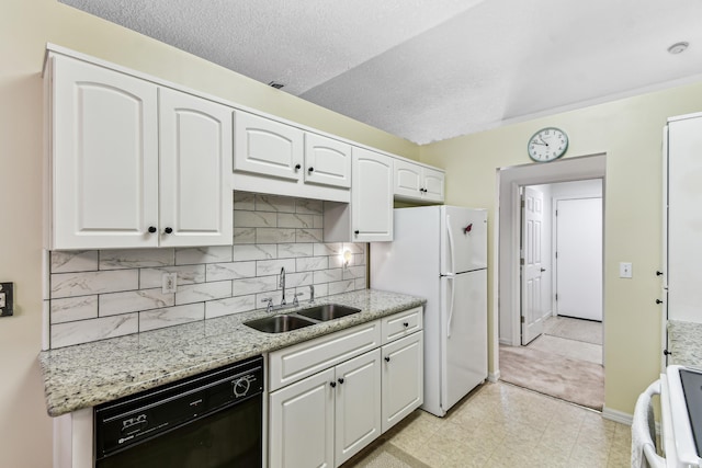 kitchen featuring white cabinetry, a sink, light stone countertops, range, and dishwasher