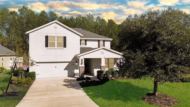 view of front of home featuring a garage and a front yard